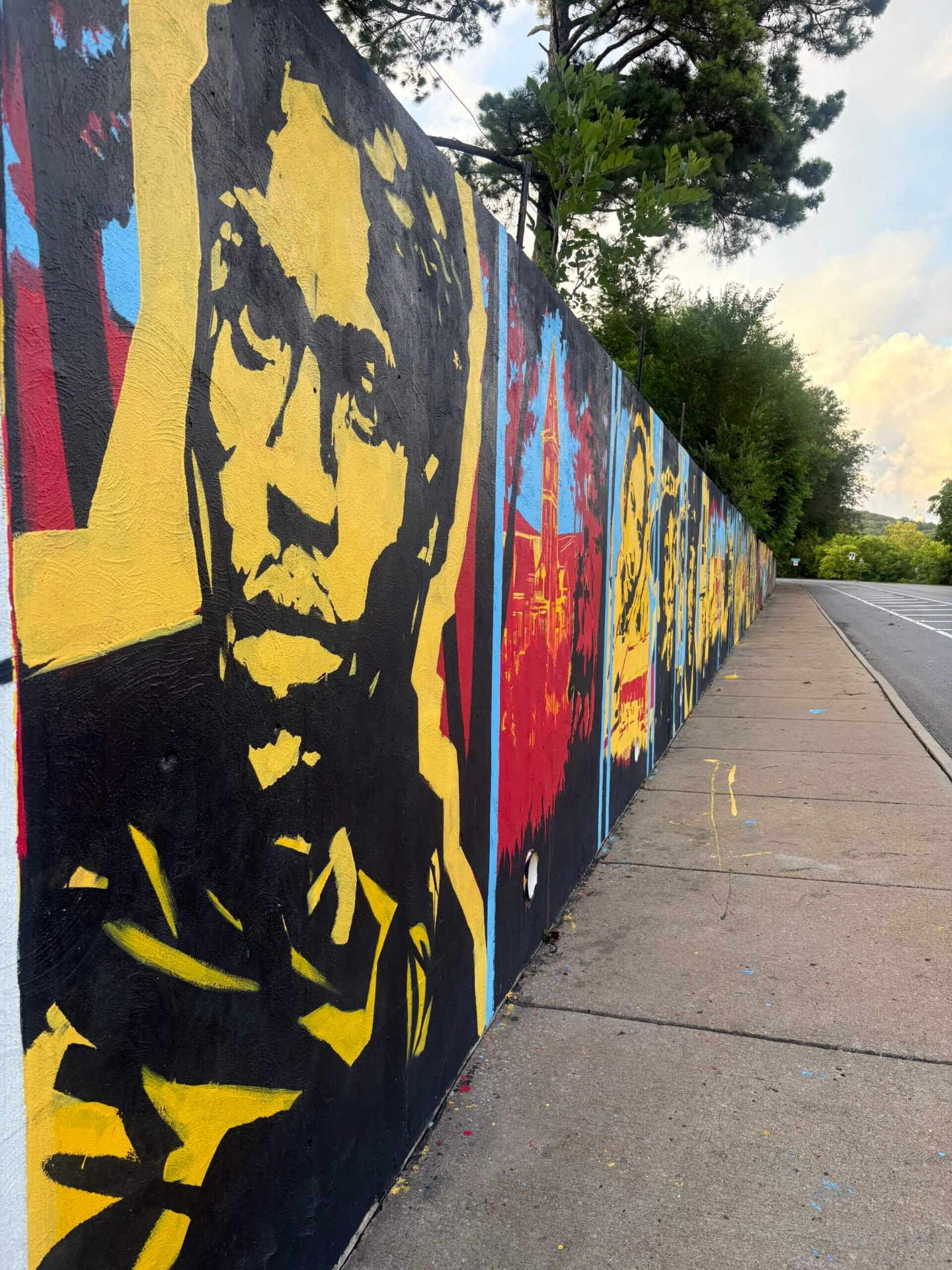 Remembrance by Joëlle Storet, a 90-foot mural along Nelson Hackett Blvd in downtown Fayetteville