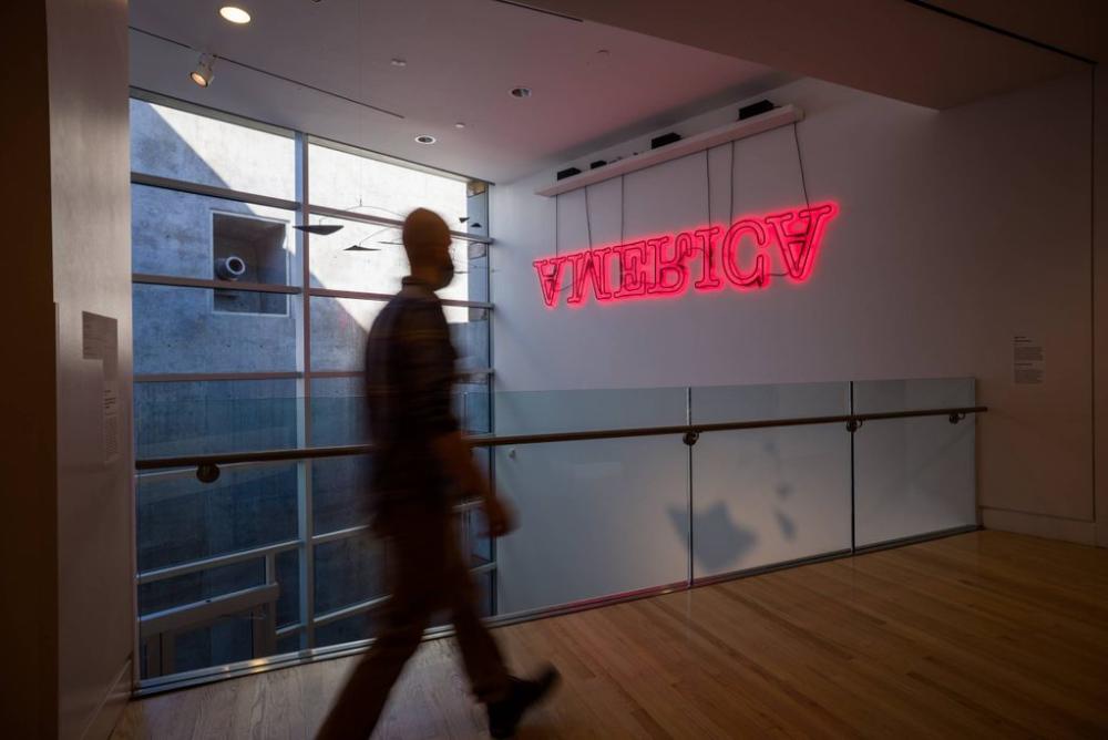 America by Glenn Ligon, red neon letters on a gallery wall at Crystal Bridges